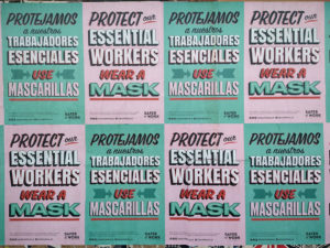 Photo of posted signs requesting workers wear masks by BP Miller