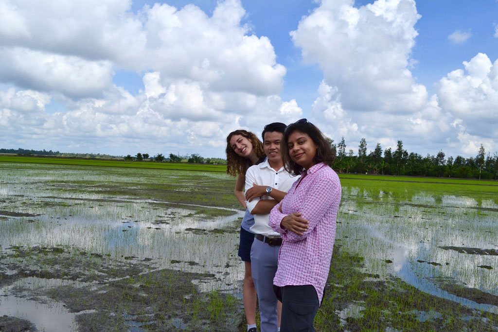 Photo of Pinki Mondal conducting fieldwork in Vietnam with student collaborators.
