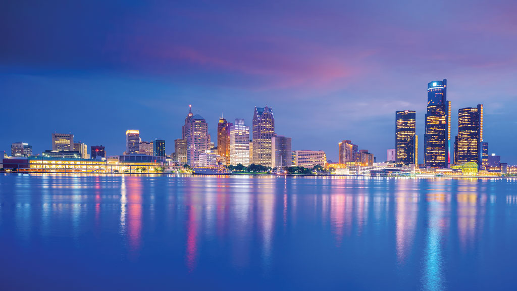 Detroit skyline at sunset showing blue and pink sky