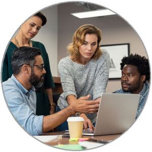 Small diverse group of people having a discussing information displayed on a laptop.